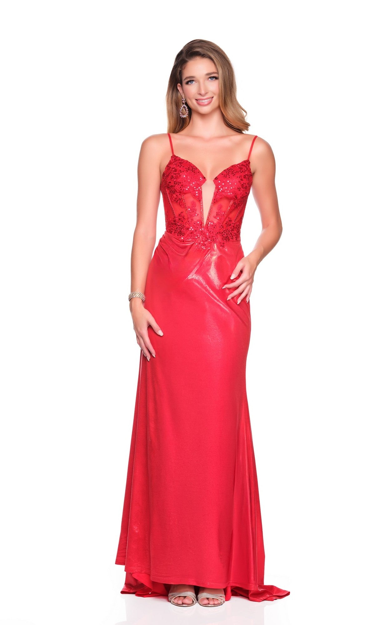 A woman stands against a white background wearing the Dave and Johnny 12740 long prom dress, featuring a sleeveless red design with a plunging neckline, sequin details, and an embellished corset bodice.